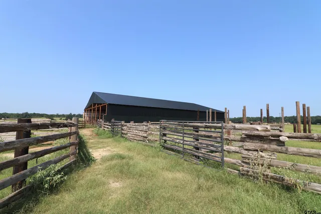 a view of a lake with houses in the back