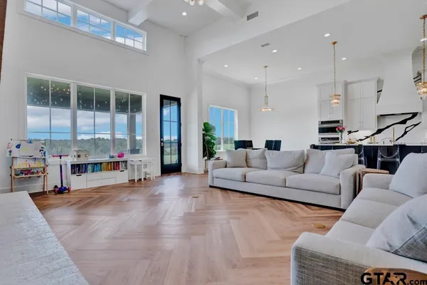 a living room with furniture and a large window