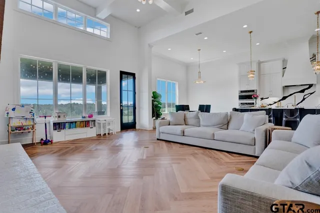 a living room with furniture and a large window