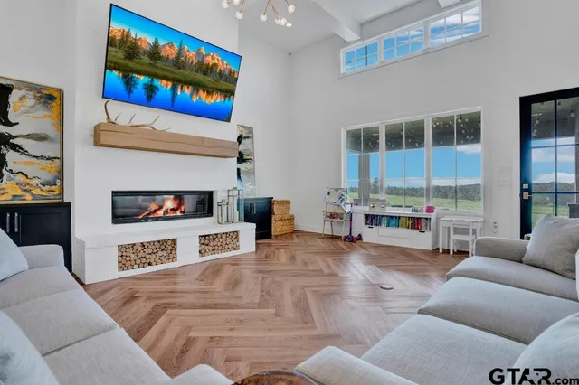a living room with furniture and a fireplace
