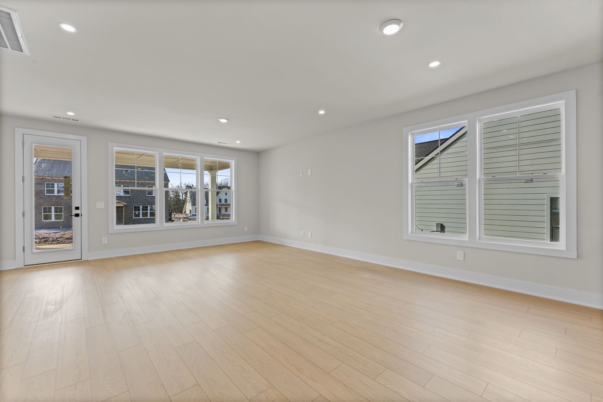 830 Silva Loop Mount Juliet, TN 37122 - Photo 8 of 29 an empty room with wooden floor and windows