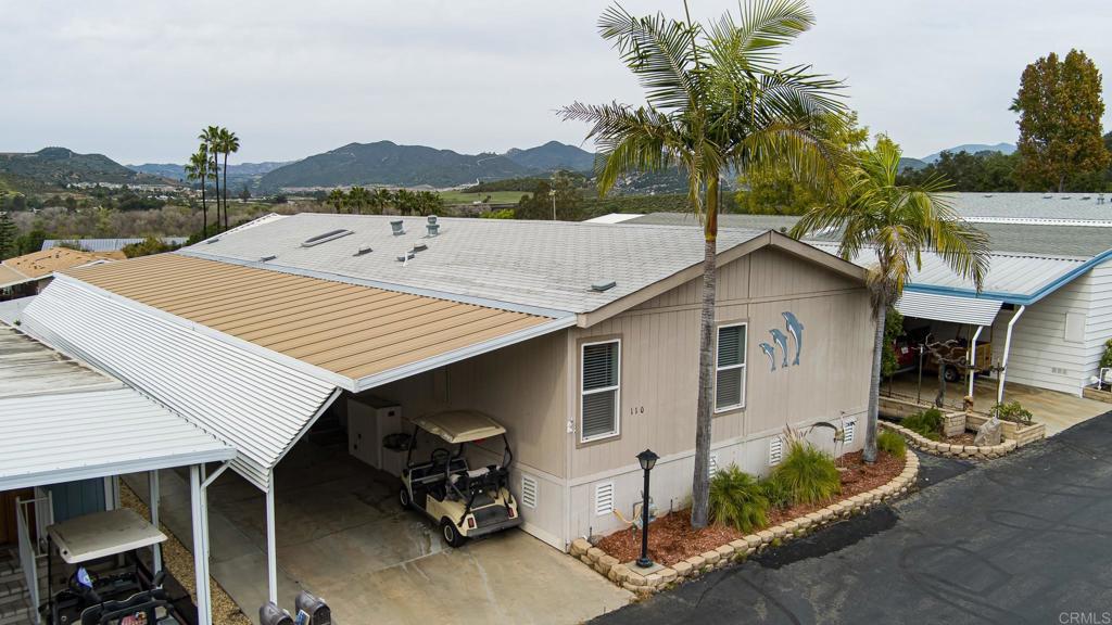 4650 Dulin Road, Unit 110 Fallbrook, CA 92003 - Photo 1 of 54 a view of house with outdoor space and seating area
