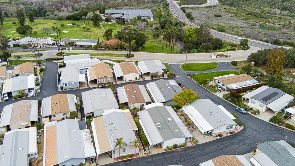 4650 Dulin Road, Unit 110 Fallbrook, CA 92003 - Photo 38 of 54 an aerial view of multiple houses with yard