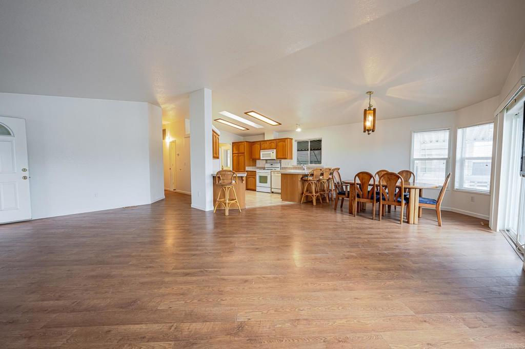 4650 Dulin Road, Unit 110 Fallbrook, CA 92003 - Photo 4 of 54 a view of a livingroom with furniture hardwood floor and windows