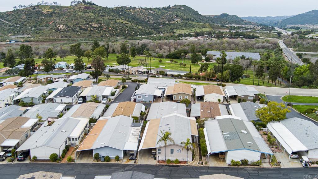 4650 Dulin Road, Unit 110 Fallbrook, CA 92003 - Photo 41 of 54 an aerial view of residential houses with outdoor space and parking