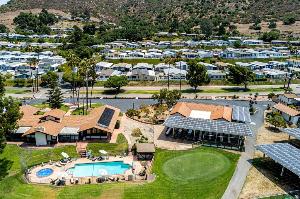4650 Dulin Road, Unit 110 Fallbrook, CA 92003 - Photo 45 of 54 an aerial view of a house with swimming pool tennis courts and ocean view