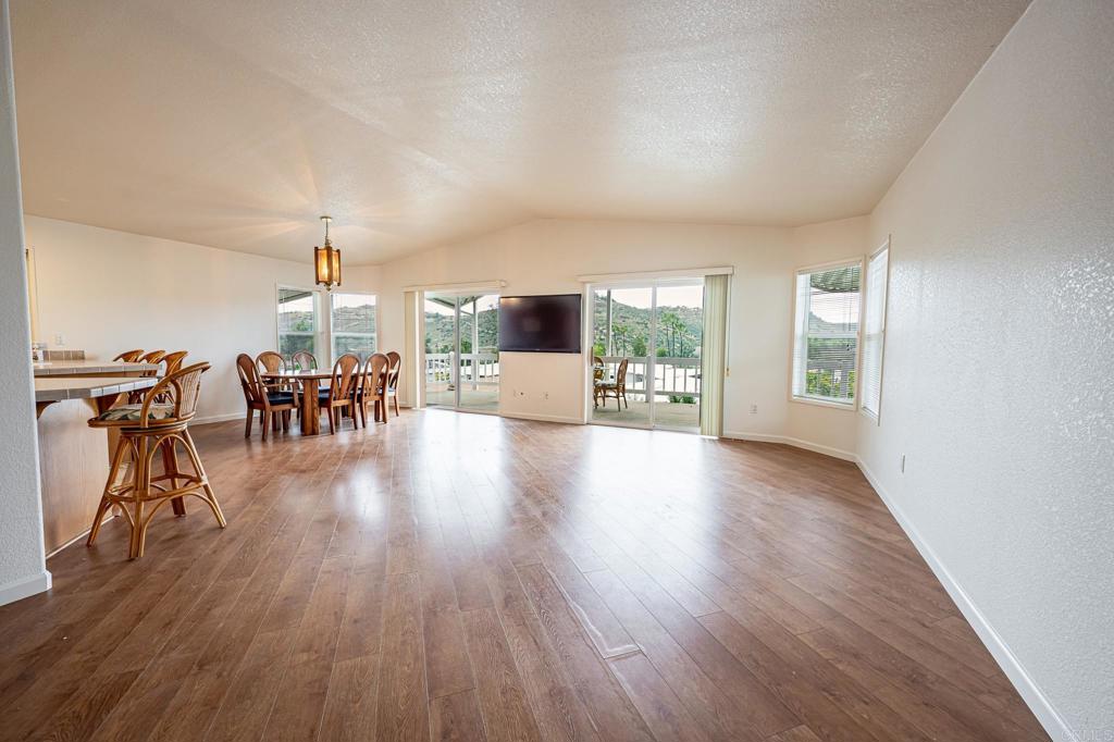 4650 Dulin Road, Unit 110 Fallbrook, CA 92003 - Photo 6 of 54 a view of a living room a dining room and wooden floor