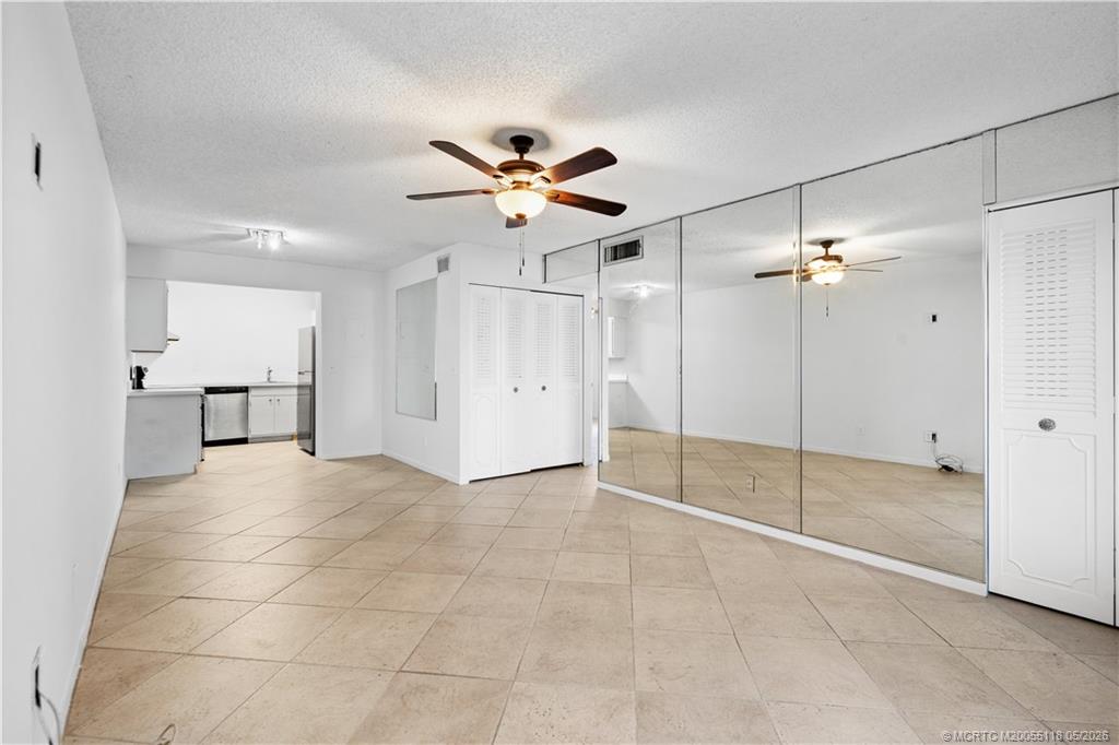 2118 Southeast Edler Drive, Unit B Stuart, FL 34994 - Photo 4 of 20 a view of an empty room and a ceiling fan window