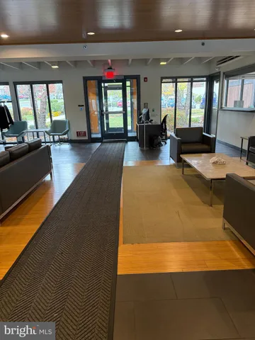 a lobby with furniture and window