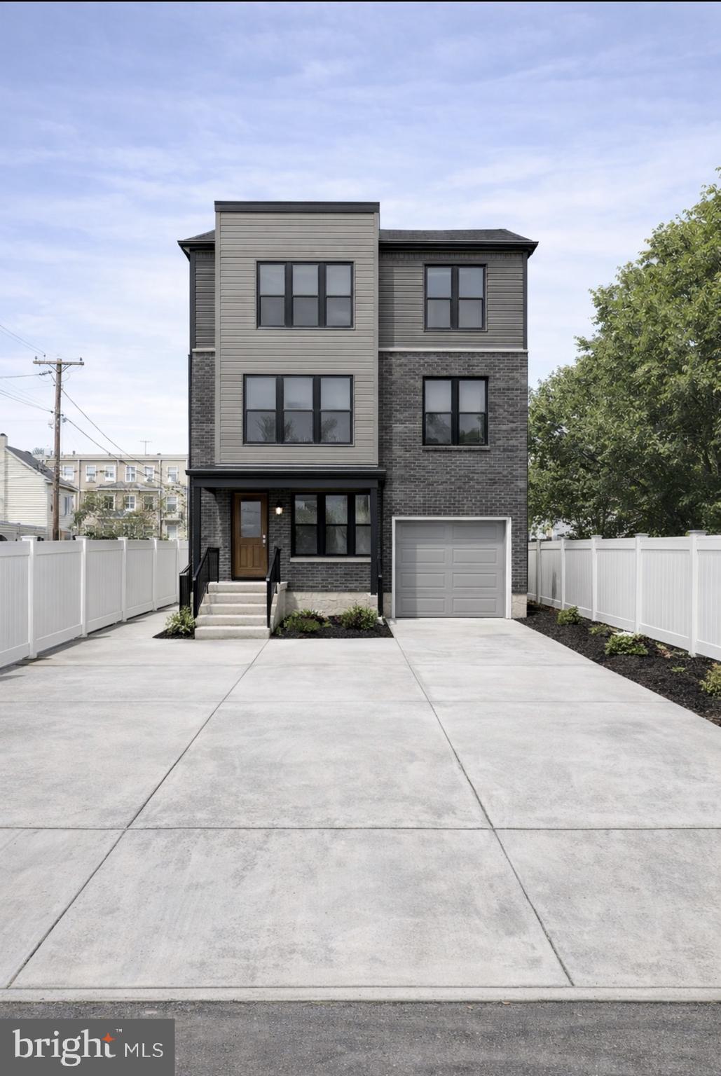 8072 Erdrick Street Philadelphia, PA 19136 - Photo 2 of 2 a front view of a house with a yard