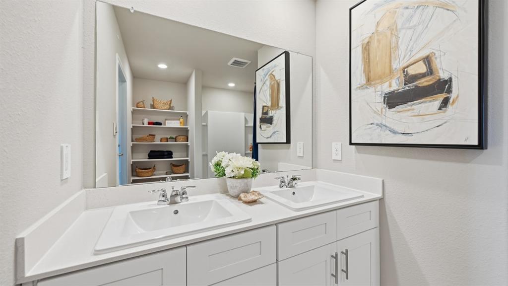 16536 Hudson Pr Way Justin, TX 76247 - Photo 19 of 39 a bathroom with a double vanity sink and a mirror