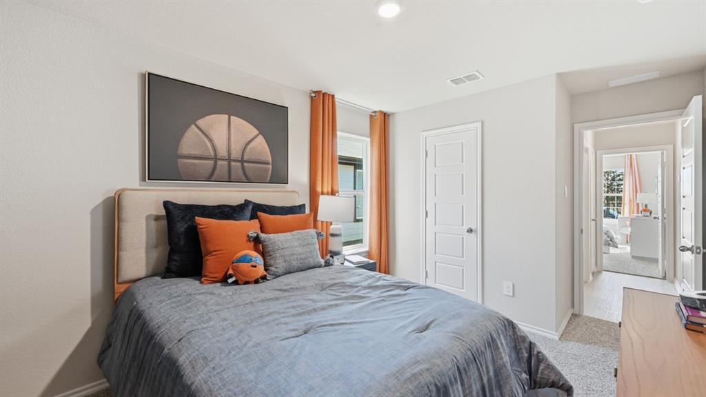 16536 Hudson Pr Way Justin, TX 76247 - Photo 23 of 39 a bedroom with bed and window