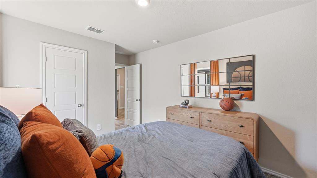 16536 Hudson Pr Way Justin, TX 76247 - Photo 24 of 39 a bedroom with bed and window