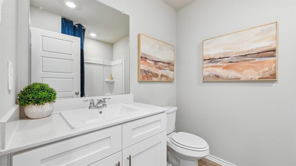 16536 Hudson Pr Way Justin, TX 76247 - Photo 26 of 39 a bathroom with a sink mirror and toilet