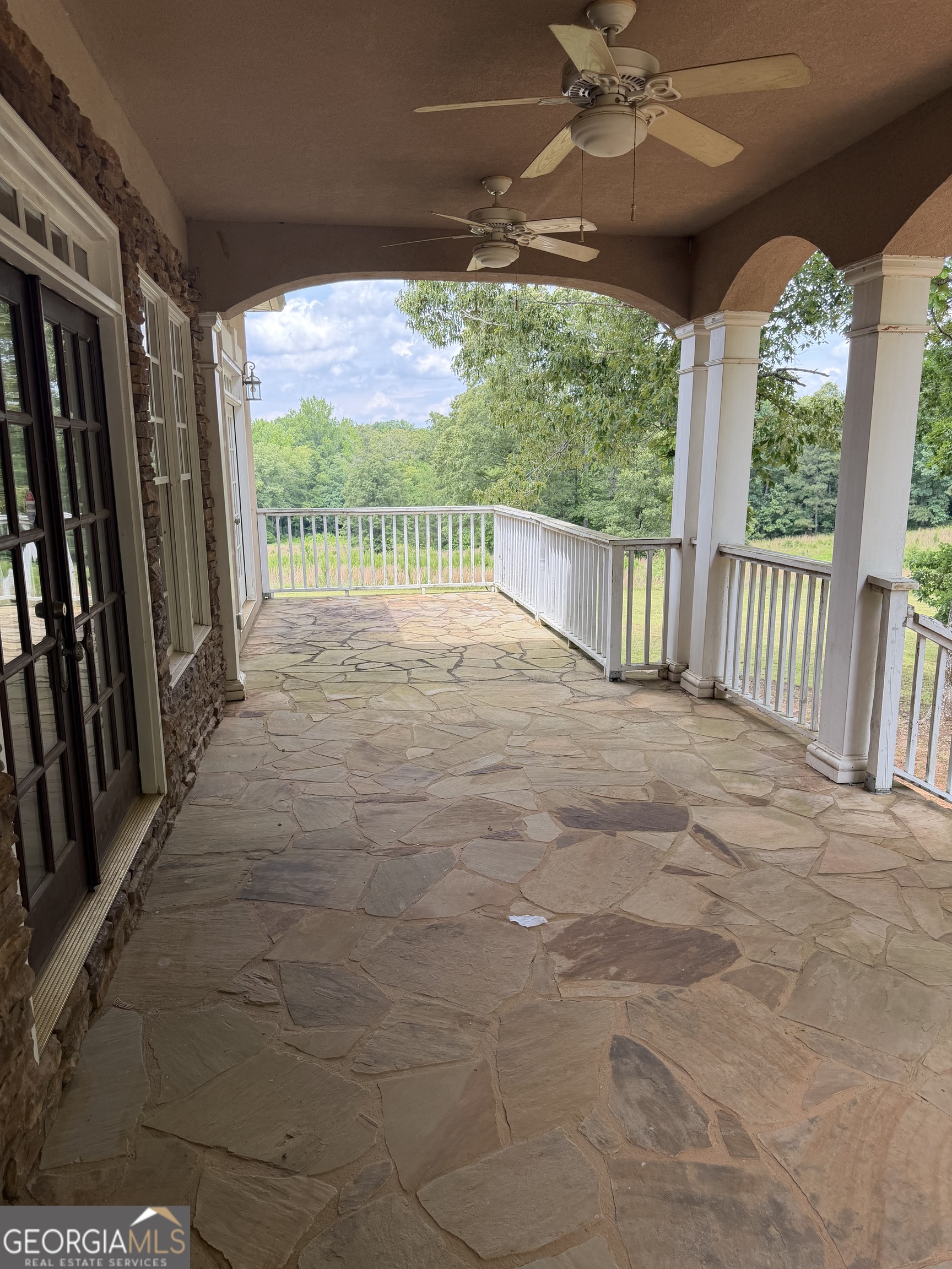 302 Norris Road Barnesville, GA 30204 - Photo 15 of 65 a view of porch with a floor to ceiling window