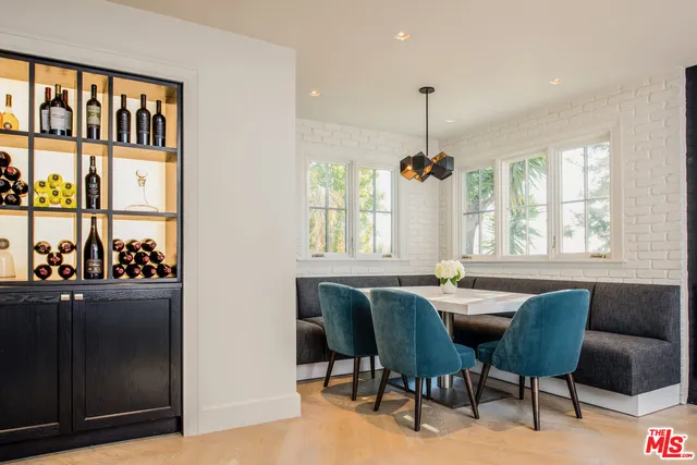 a dining room with furniture window and outside view