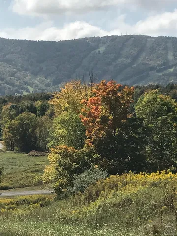 a kitchen with stainless steel appliances a refrigerator sink and stove
