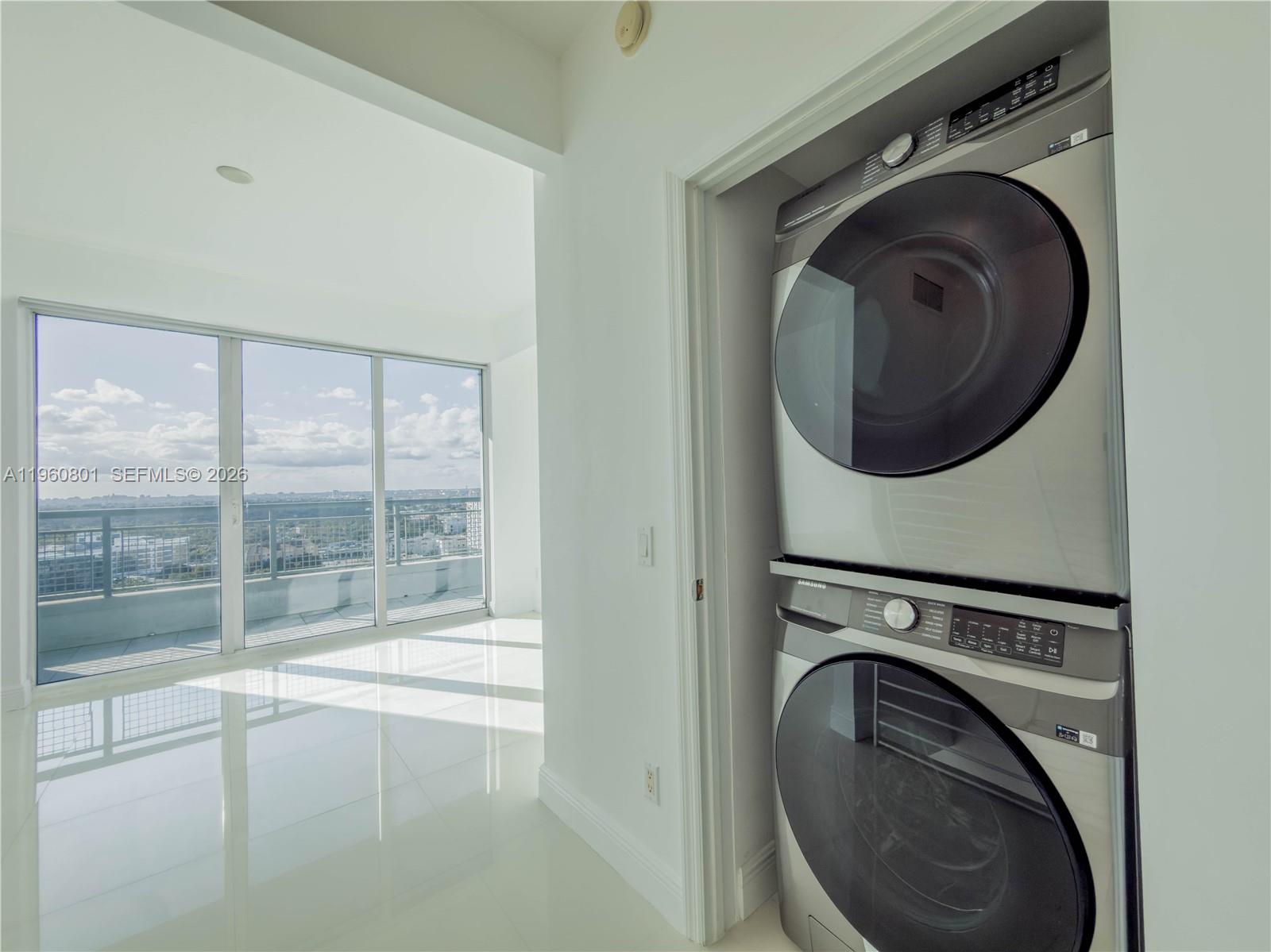 60 Southwest 13th Street, Unit 1605 Miami, FL 33130 - Photo 11 of 30 a view of a washer and dryer in a utility room