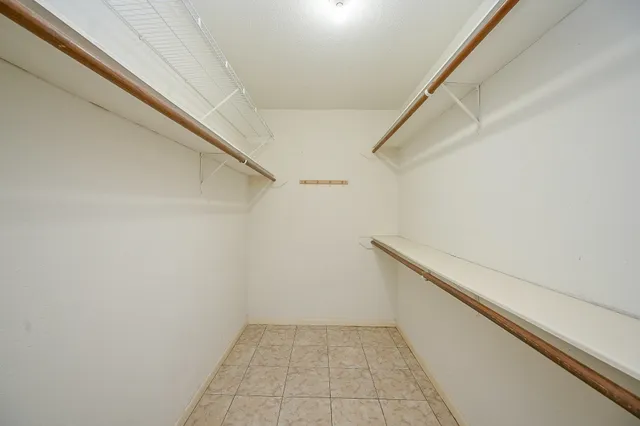 a view of an empty walk in closet