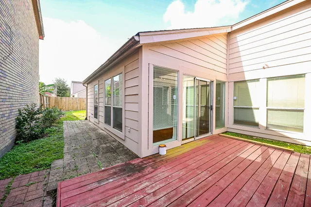 a view of backyard with large windows