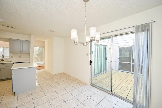 a bathroom with a glass shower door and a bathtub