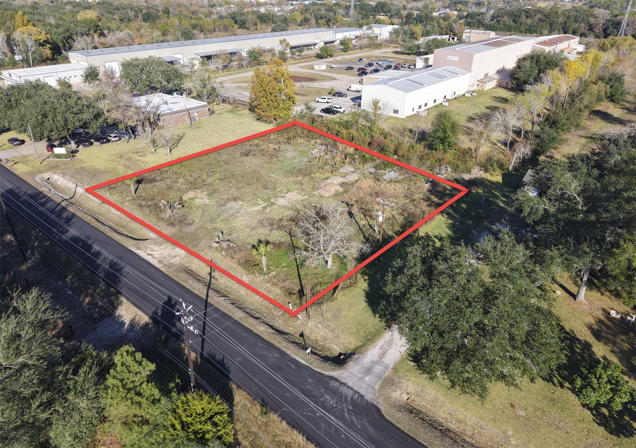 a view of a backyard with wooden fence