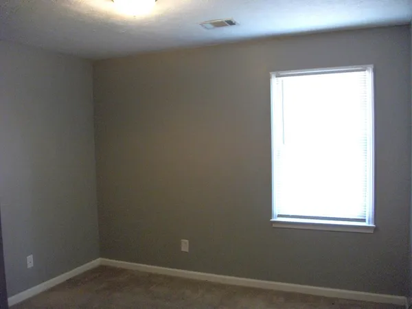 a room with furniture and a window