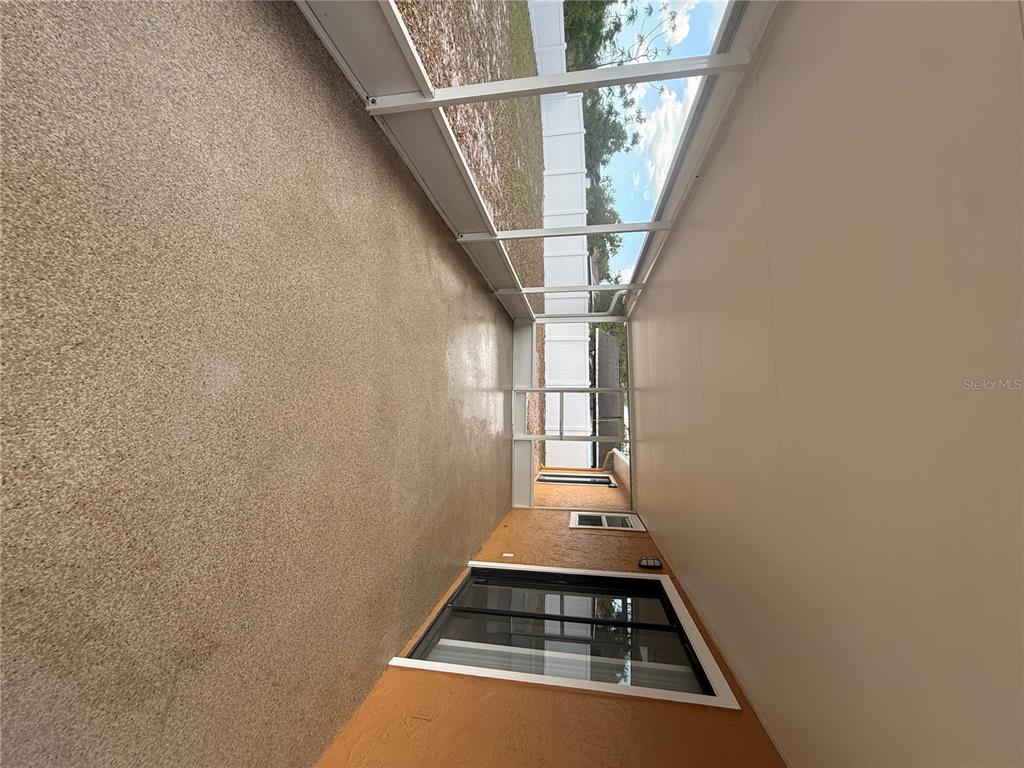 7350 Landmark Drive Spring Hill, FL 34606 - Photo 13 of 16 a view of entryway and hall with wooden floor