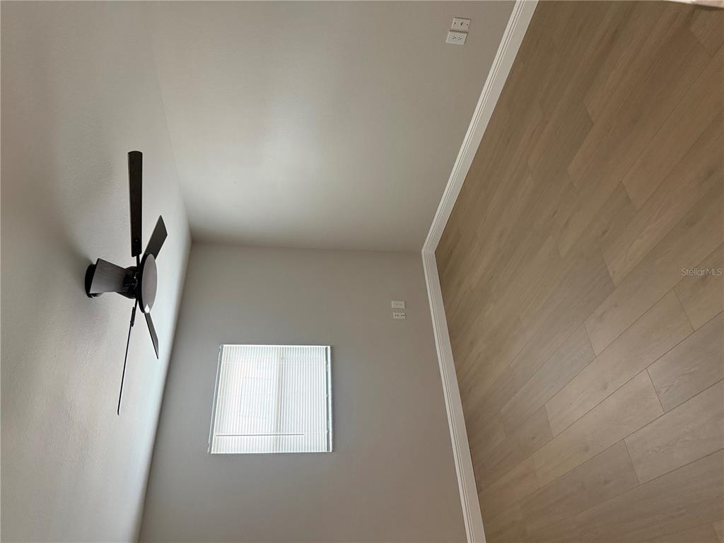 7350 Landmark Drive Spring Hill, FL 34606 - Photo 5 of 16 a view of a hallway with a white wall and a window