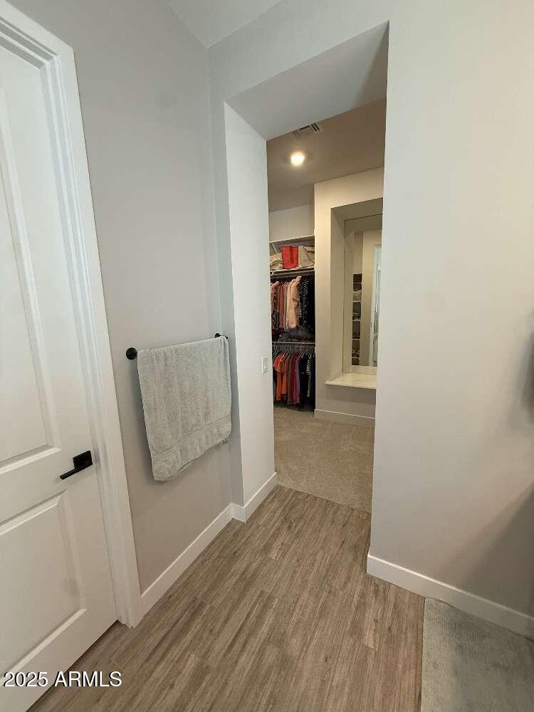 1932 West Rowel Road Phoenix, AZ 85085 - Photo 14 of 24 a view of hallway with wooden floor and stairs