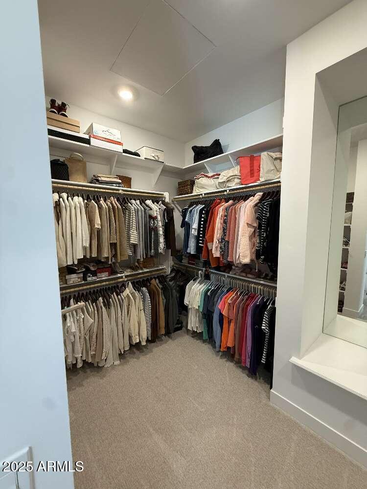 1932 West Rowel Road Phoenix, AZ 85085 - Photo 15 of 24 a view of walk in closet with clothes and shoes
