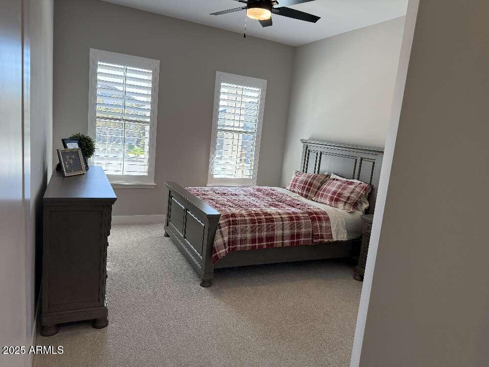 1932 West Rowel Road Phoenix, AZ 85085 - Photo 16 of 24 a bedroom with a bed and a table in it