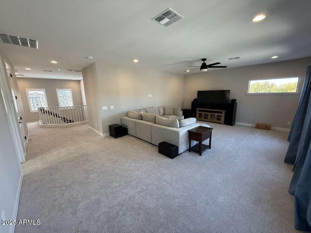 1932 West Rowel Road Phoenix, AZ 85085 - Photo 19 of 24 a living room with furniture and a flat screen tv