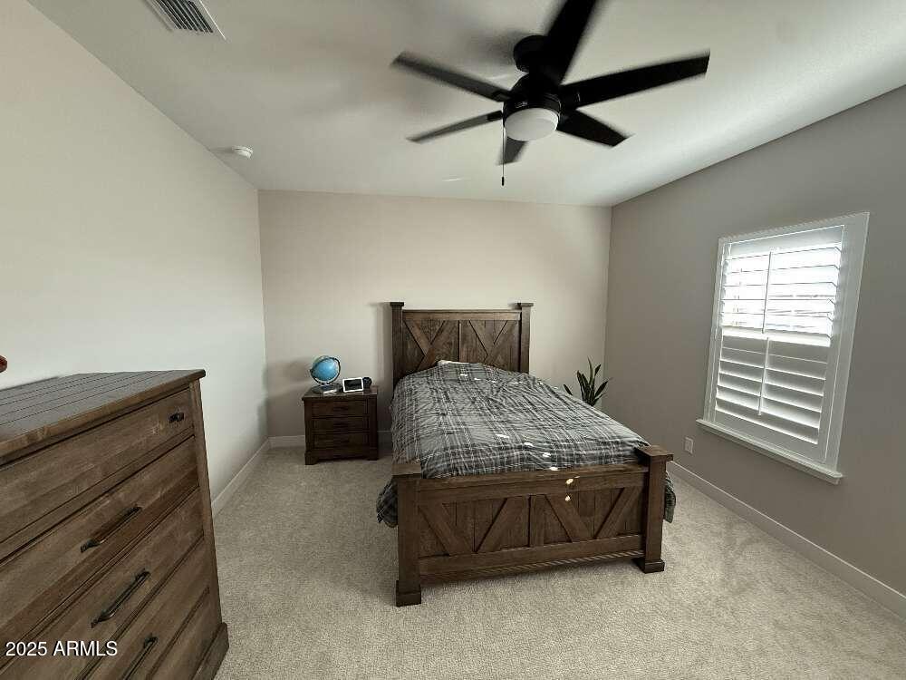 1932 West Rowel Road Phoenix, AZ 85085 - Photo 22 of 24 a bedroom with a bed and a ceiling fan