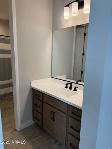 a bathroom with a sink and a mirror