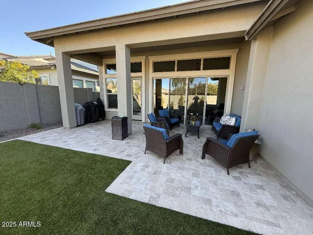 a building outdoor space with patio furniture and potted plant