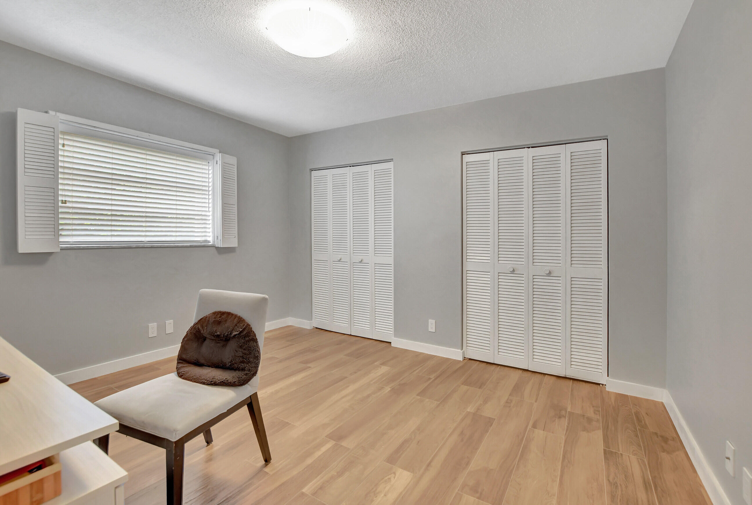 510 Silver Lane Boca Raton, FL 33432 - Photo 13 of 24 a view of a workspace with furniture and a window
