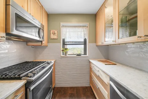a kitchen with a stove and a microwave