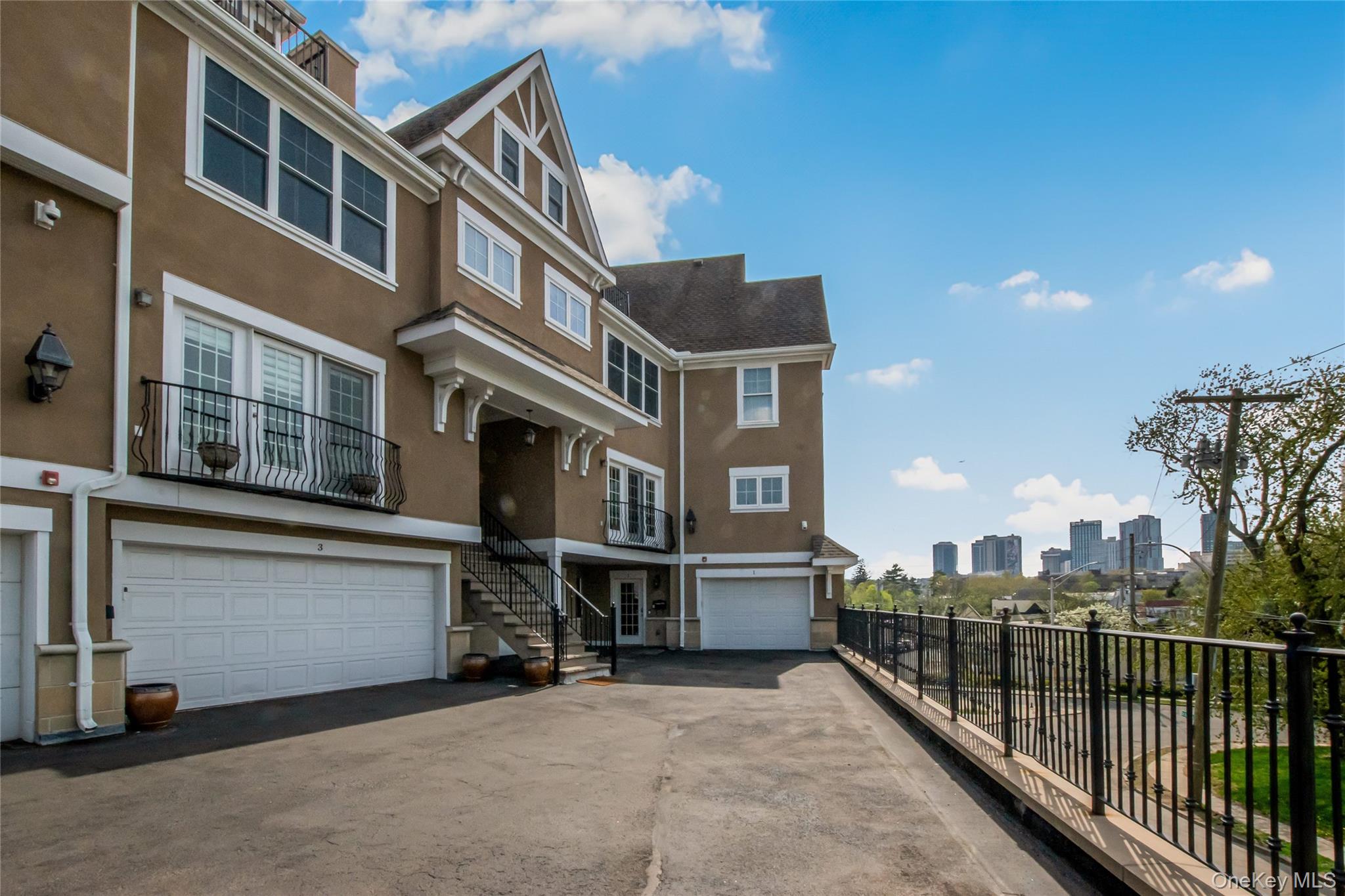 80 Old Boston Post Road, Unit 2 New Rochelle, NY 10801 - Photo 1 of 29 a view of a building with many windows