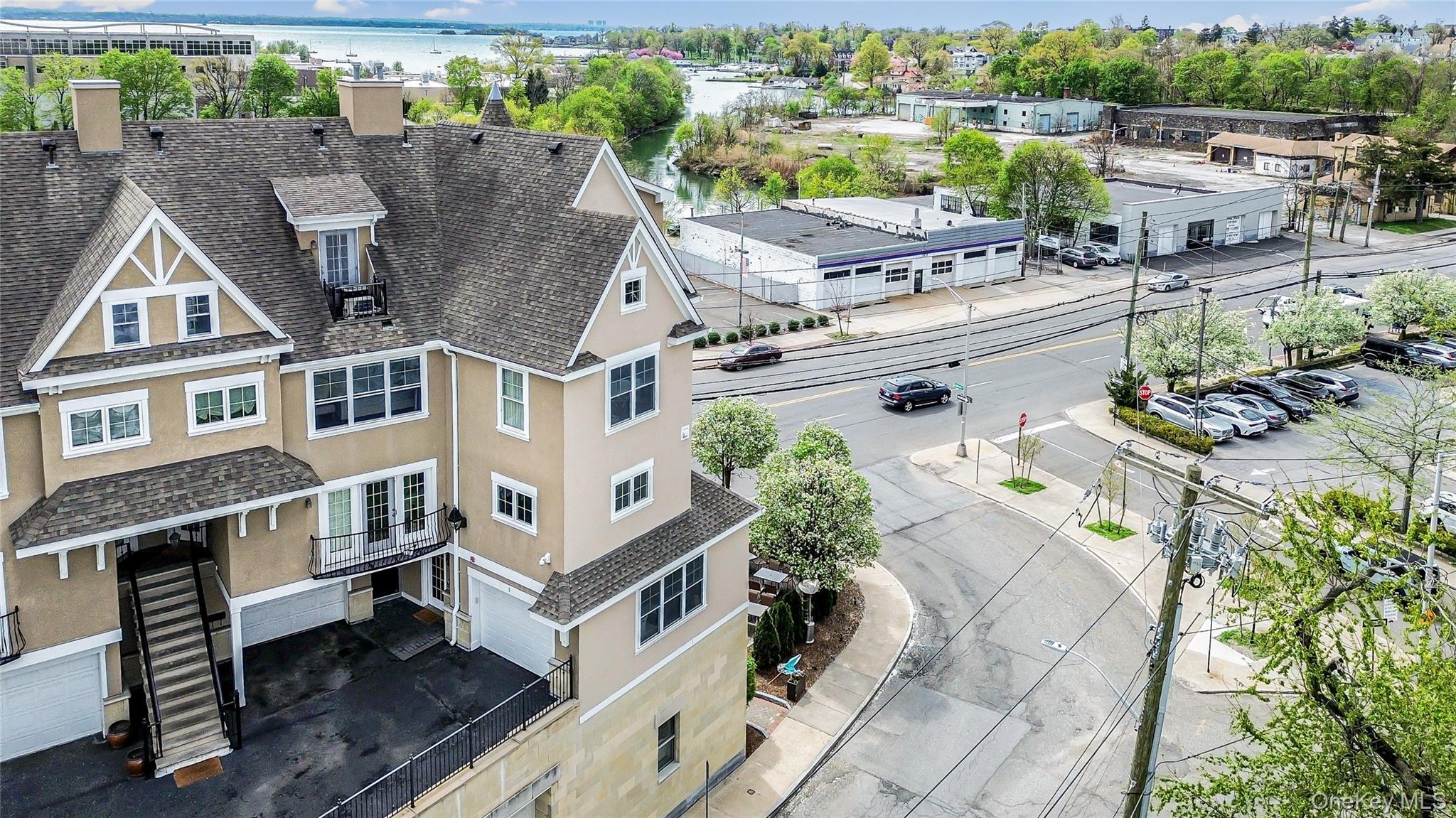 80 Old Boston Post Road, Unit 2 New Rochelle, NY 10801 - Photo 2 of 29 an aerial view of a house with a garden