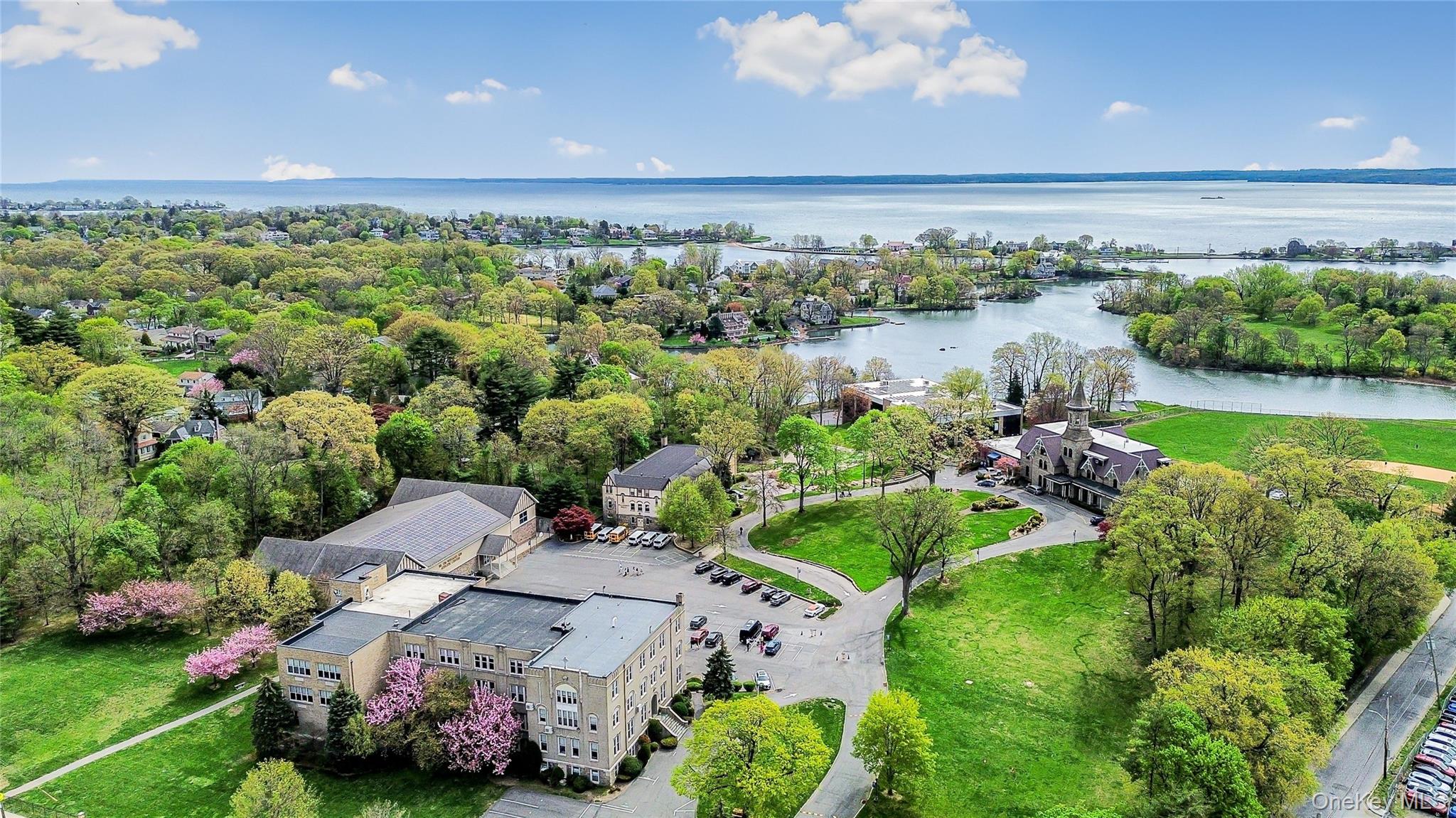 80 Old Boston Post Road, Unit 2 New Rochelle, NY 10801 - Photo 5 of 29 a view of a lake with a building in the background