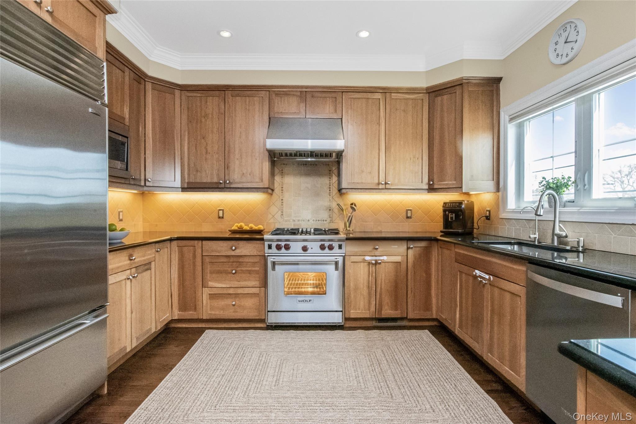 80 Old Boston Post Road, Unit 2 New Rochelle, NY 10801 - Photo 9 of 29 a kitchen with stainless steel appliances granite countertop a sink stove and cabinets