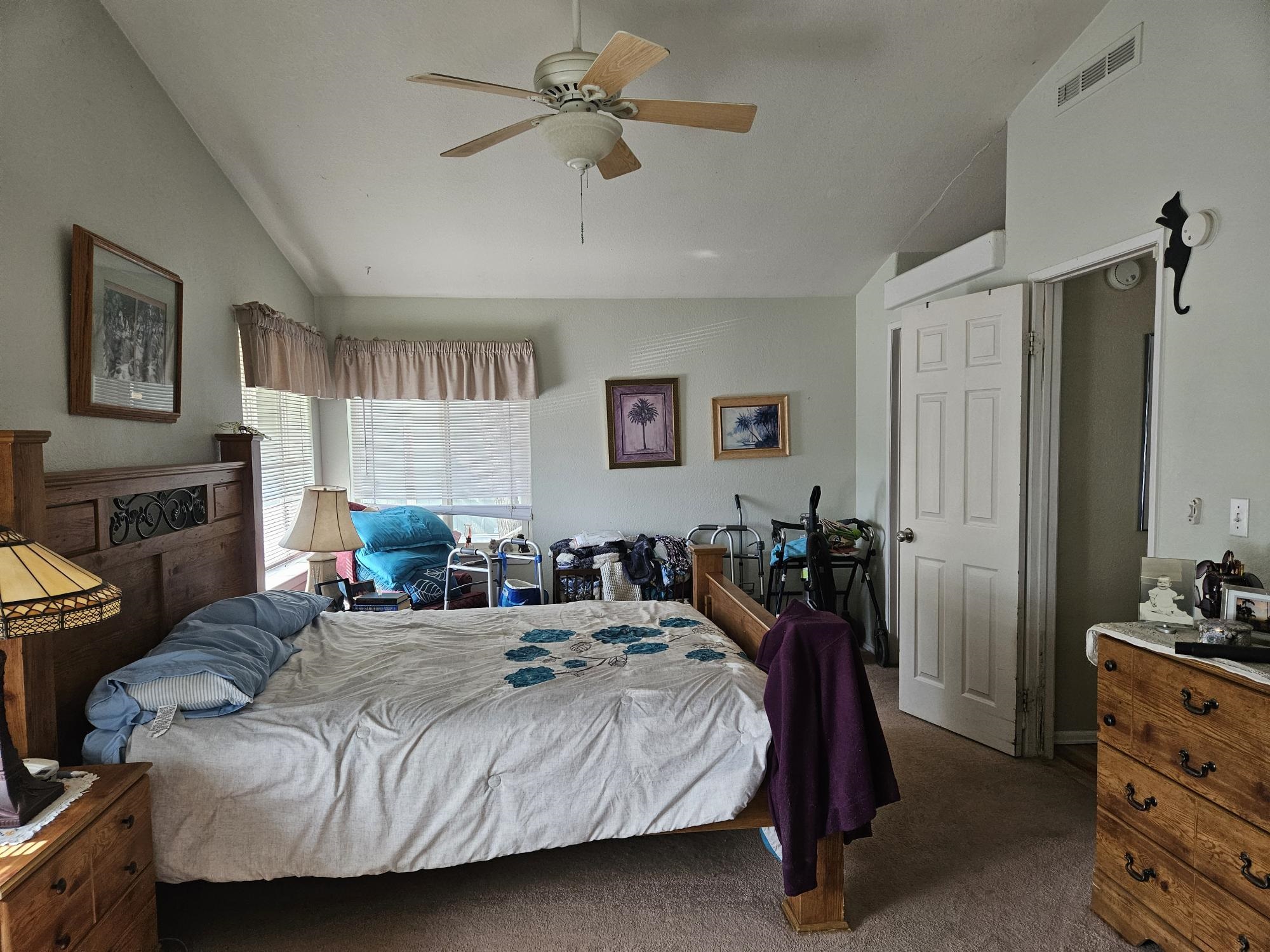 435 32 Road, Unit 424 Clifton, CO 81520 - Photo 16 of 21 a bed room with a bed a couch and a chandelier