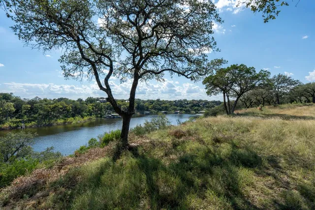 a view of a lake in middle of a forest