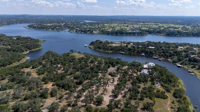 an aerial view of a houses with ocean view