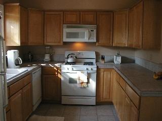 1831 Beaver Street Santa Rosa, CA 95404 - Photo 5 of 10 a kitchen with stainless steel appliances granite countertop a sink stove and microwave