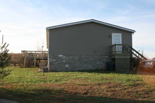 618 Sparrow Road Lafayette, TN 37083 - Photo 8 of 9 Side view...note rear deck and fenced dog run