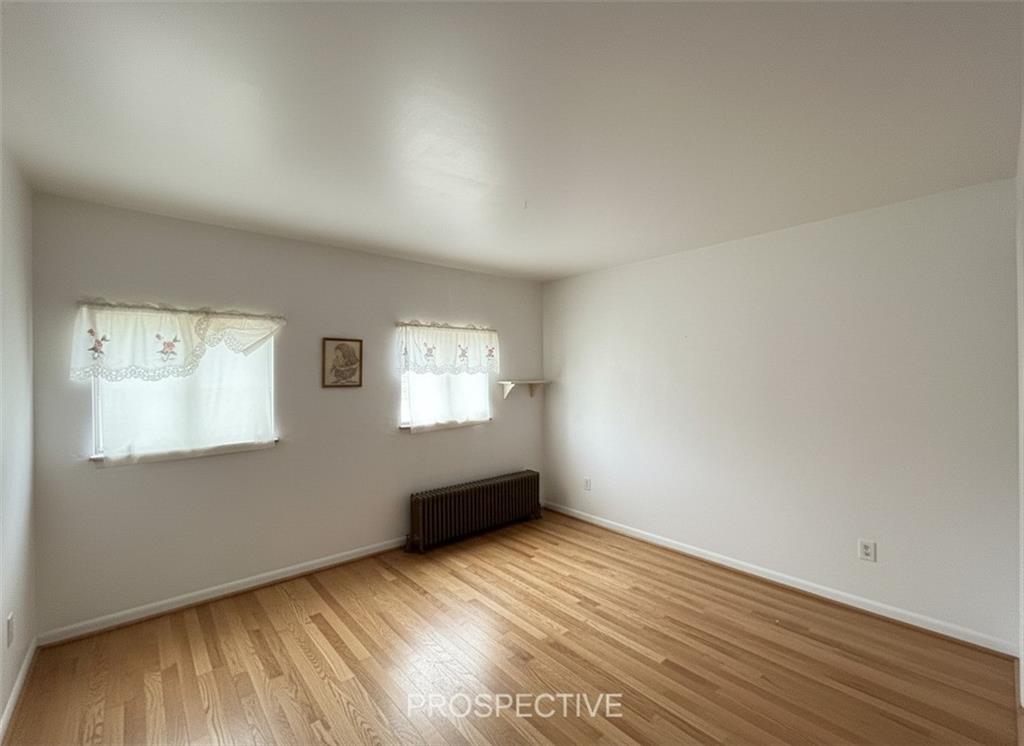 311 Magazine Street Carnegie, PA 15106 - Photo 13 of 16 an empty room with wooden floor and windows
