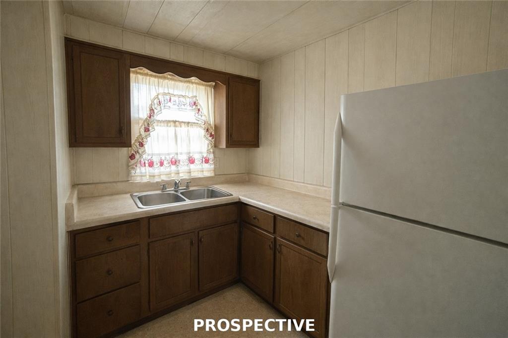311 Magazine Street Carnegie, PA 15106 - Photo 9 of 16 a kitchen with a sink and a refrigerator