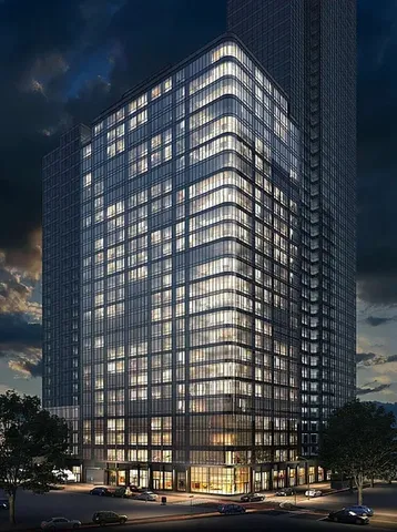 a view of a building with shower and yard